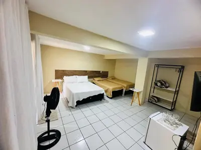 Uma cama ou camas num quarto em Suites Holanda