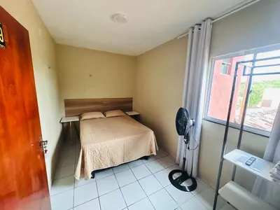 Uma cama ou camas num quarto em Suites Holanda