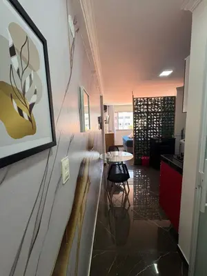 Uma área de estar em Flat com vista mar na orla