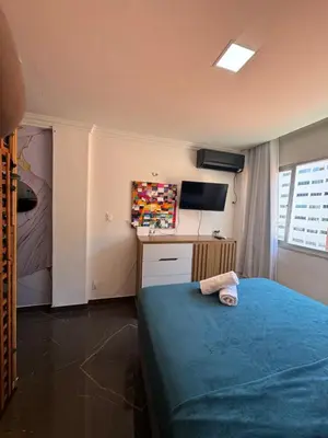 Uma cama ou camas num quarto em Flat com vista mar na orla