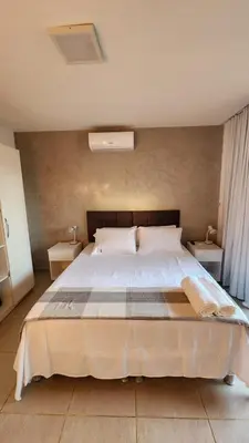Uma cama ou camas num quarto em Paraíso à Beira Mar - 601H Village