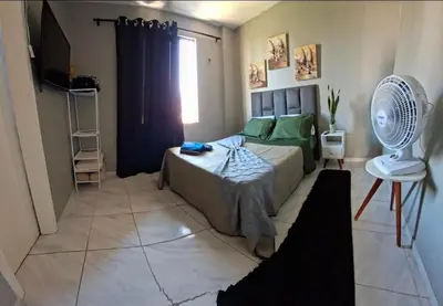 Uma cama ou camas num quarto em Apartamento em cond na Praia do Futuro com 2 suítes