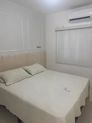Uma cama ou camas num quarto em Apartamento novo 01