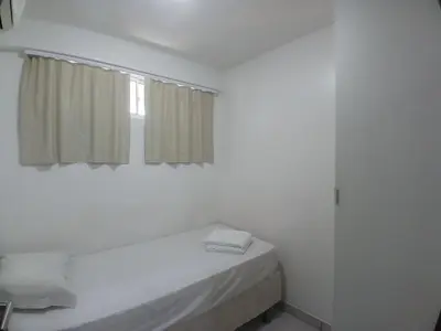 Uma cama ou camas num quarto em Beach Class Fortaleza