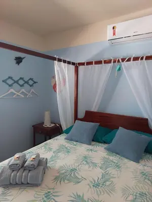 Uma cama ou camas num quarto em Manga Rosa Hospedagem