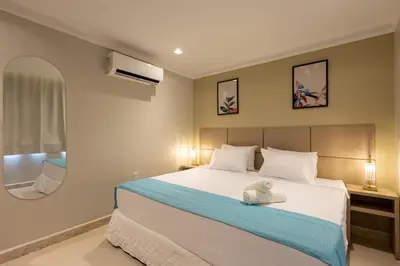Uma cama ou camas num quarto em Aira Hotel