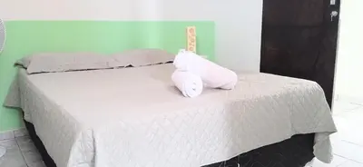 Uma cama ou camas num quarto em casa em fortaleza bairro parquelândia