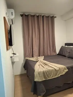 Uma cama ou camas num quarto em Ap 2 quartos ,condomínio mirante clube
