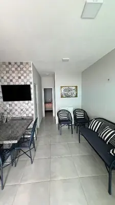 Uma área de estar em Casa do Airton