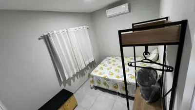 Uma cama ou camas num quarto em Casa do Airton