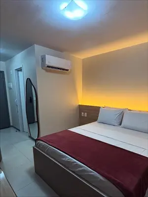 Uma cama ou camas num quarto em Beach Class Meireles