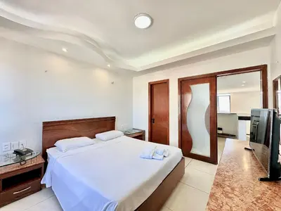 Uma cama ou camas num quarto em Flats Tabajara Residence