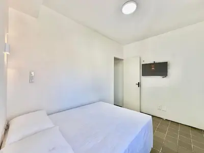 Uma cama ou camas num quarto em Flats Tabajara Residence
