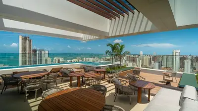 Uma área de estar em Studio Beira-mar, rooftop com piscina e jacuzzi
