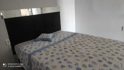 Uma cama ou camas num quarto em Apartamento em Fortaleza