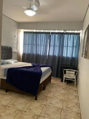 Uma cama ou camas num quarto em coberturas praia do futuro