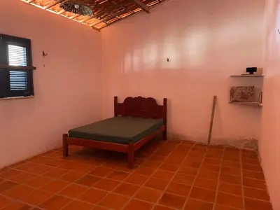 Uma cama ou camas num quarto em Casa Pitombeira