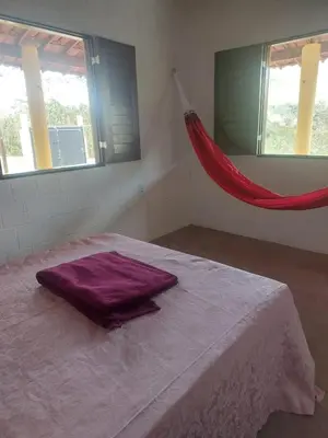 Uma cama ou camas num quarto em Sítio Cantim da MiMi