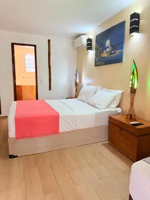Uma cama ou camas num quarto em Pousada Calamarina