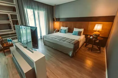 Uma cama ou camas num quarto em Carmel Cumbuco Resort