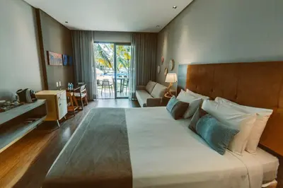 Uma cama ou camas num quarto em Carmel Cumbuco Resort