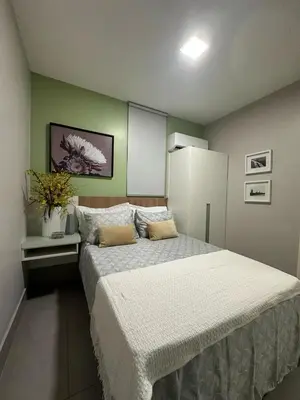 Uma cama ou camas num quarto em Benfica Apart Hotel