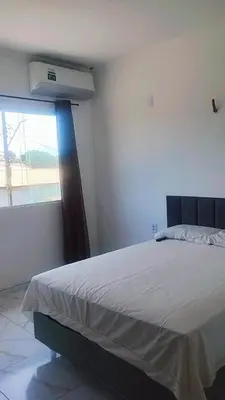 Uma cama ou camas num quarto em Pousada Residencial Manzuá