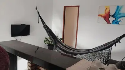 Uma televisão e/ou sistema de entretenimento em Pousada Residencial Manzuá