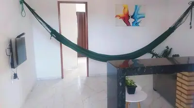 Uma televisão e/ou sistema de entretenimento em Pousada Residencial Manzuá