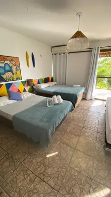 Uma cama ou camas num quarto em Pousada Chiveve
