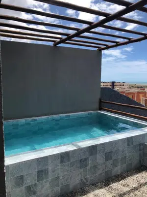 A piscina em ou perto de Chalé Vista ao Mar gray