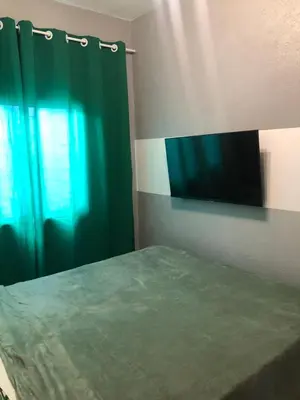 Uma cama ou camas num quarto em Chalé Vista ao Mar gray