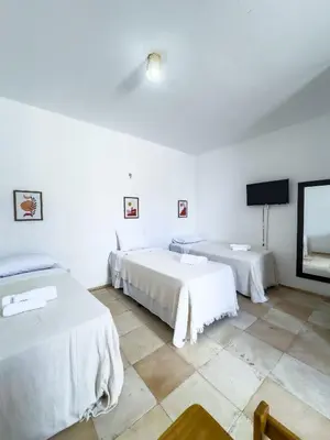 Uma cama ou camas num quarto em Pousada Mahalo Preá Beach