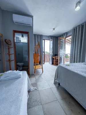 Uma cama ou camas num quarto em Pousada Mahalo Preá Beach