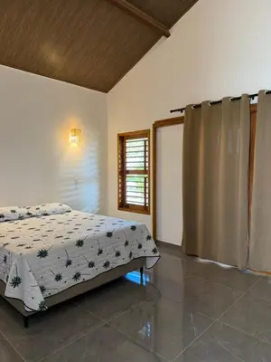 Uma cama ou camas num quarto em Pousada Lagoa do Paraíso