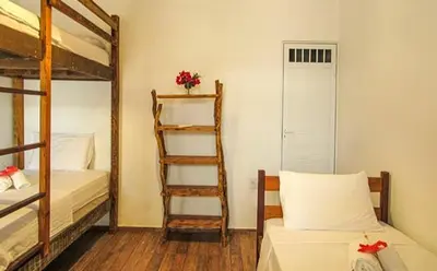 Uma cama ou camas num quarto em Che Brazil Pousada