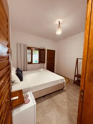 Uma cama ou camas num quarto em Lu Pousada Charme Preá