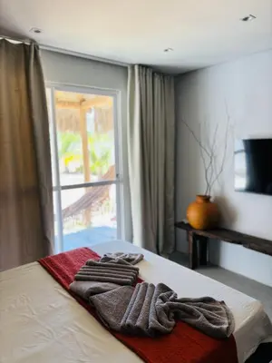 Uma cama ou camas num quarto em Jaguarype Bangalôs