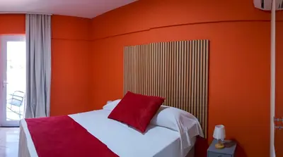 Uma cama ou camas num quarto em Davila Flat Hotel