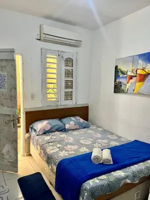 Uma cama ou camas num quarto em Recanto canoa da costureira Fran