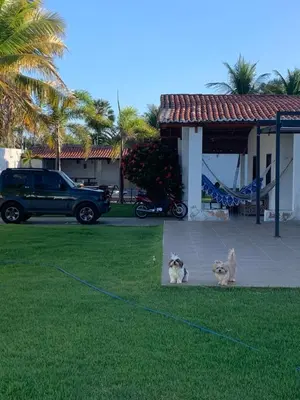 Um jardim no exterior de Casa de praia com beach tênis Caponga