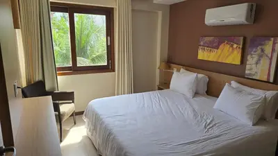 Uma cama ou camas num quarto em Beachfront Ap 314 Kariri Beach