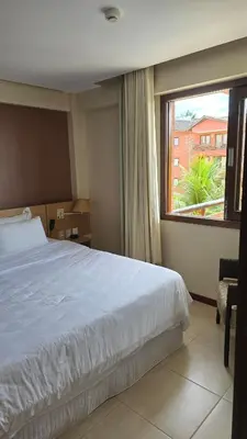 Uma cama ou camas num quarto em Beachfront Ap 314 Kariri Beach