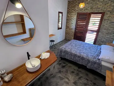 Uma cama ou camas num quarto em Casa Farol - Praia de Itarema, CE