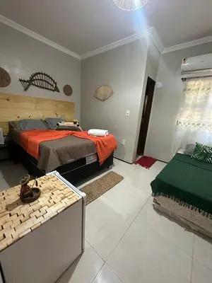 Uma cama ou camas num quarto em Pousada Delicias da vila
