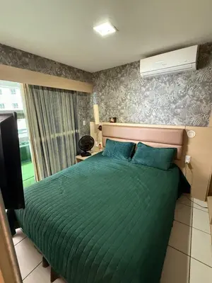 Uma cama ou camas num quarto em 1605 dos quartos Beach Class Vista Mar