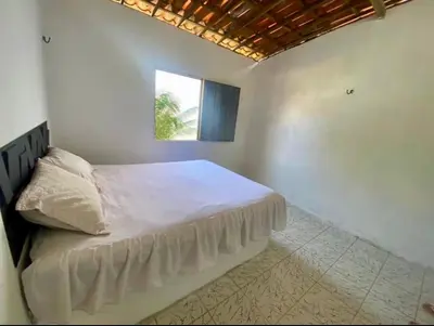 Uma cama ou camas num quarto em Martins
