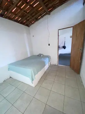 Uma cama ou camas num quarto em Martins