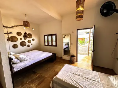 Uma cama ou camas num quarto em Casa Tartaruga Emboaca Trairí