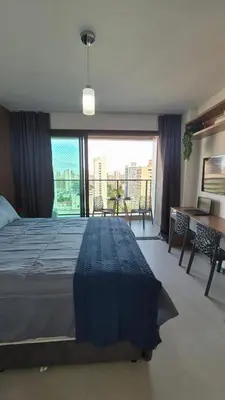 Uma cama ou camas num quarto em Studio moderno e completo Perto da Av, Beira Mar